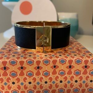 Back and gold wide Tory Burch clasp bracelet